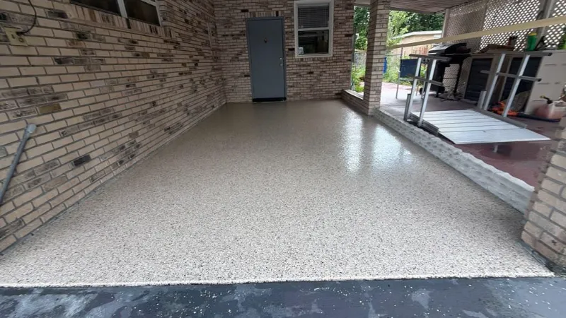 Beige flake epoxy covered patio installed by Epoxy One