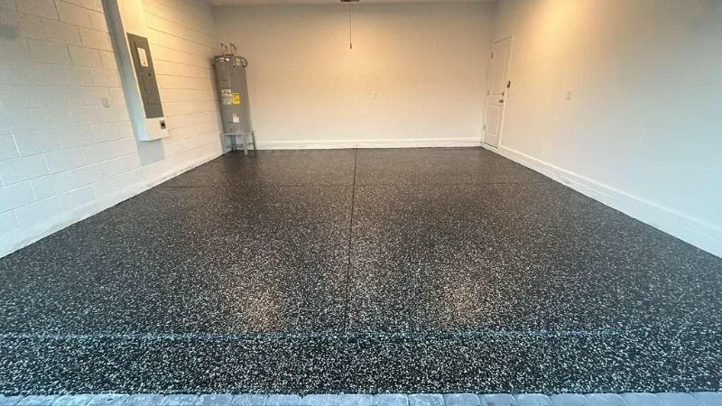 Black flake epoxy garage floor installed by Epoxy One