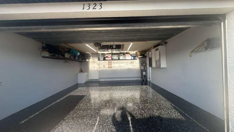 Black flake epoxy garage floor installed by Epoxy One