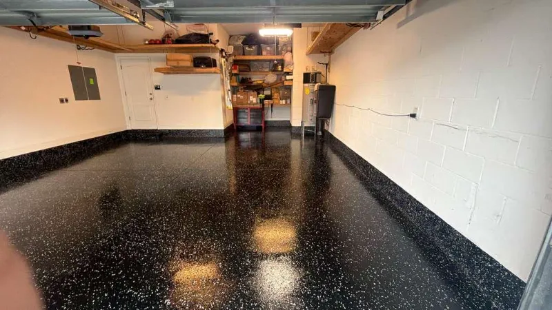 Black flake epoxy garage workshop installed by Epoxy One