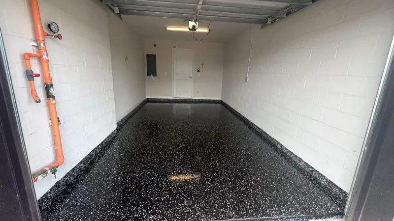 Black flake epoxy single-car garage installed by Epoxy One
