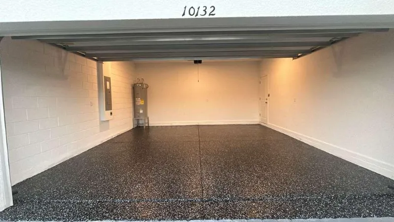 Black flake epoxy two-car garage installed by Epoxy One