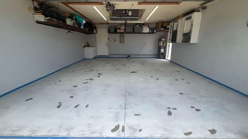 Garage concrete cracks filled and repaired before epoxy coating