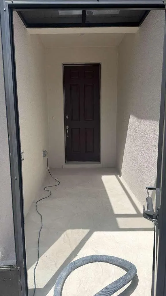 Covered entryway concrete before coating