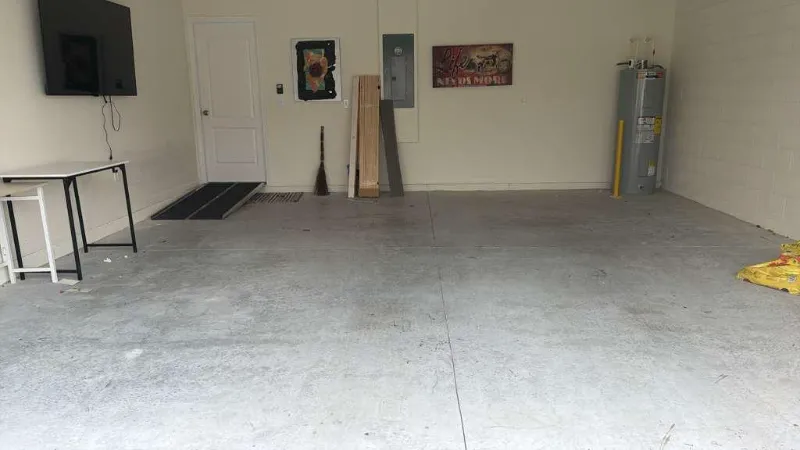 Bare, stained garage concrete before coating