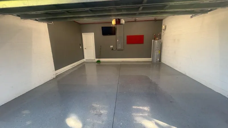 Gray 100% solids epoxy base coat applied to a garage floor