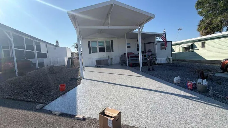 Same carport with a gray flake epoxy coating installed by Epoxy One