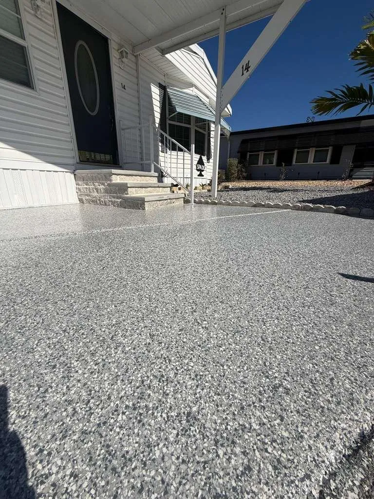Gray flake epoxy carport close-up installed by Epoxy One