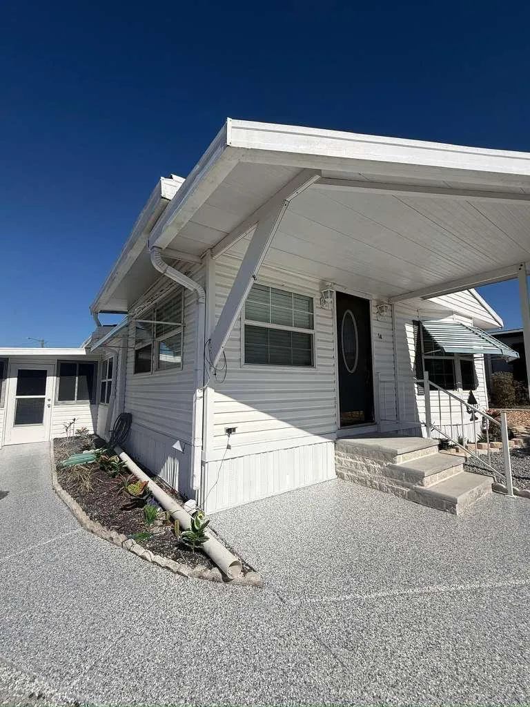 Gray flake epoxy carport and porch installed by Epoxy One
