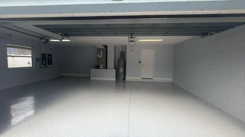 Same garage with a gray flake epoxy floor installed by Epoxy One