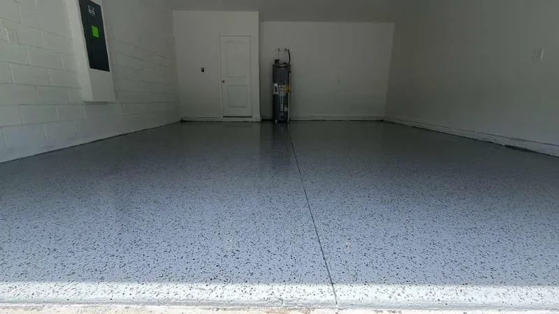 Gray flake epoxy garage floor installed by Epoxy One