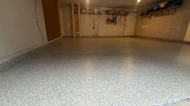 Gray flake epoxy garage floor installed by Epoxy One