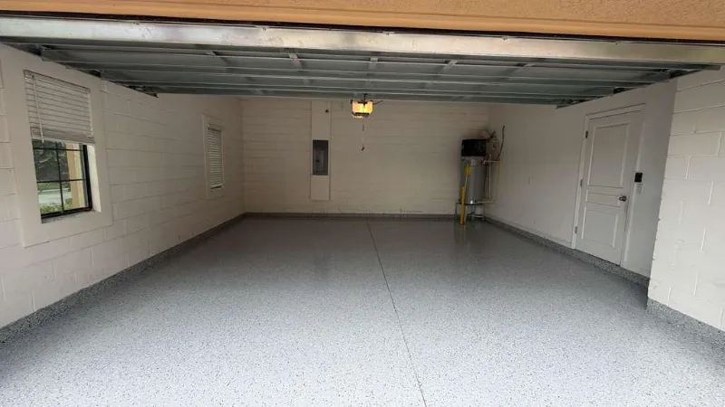 Gray flake epoxy garage floor installed by Epoxy One