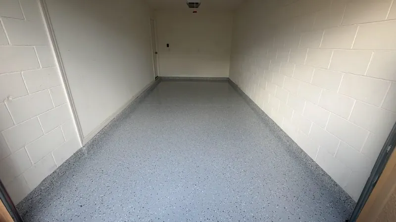Gray flake epoxy narrow garage installed by Epoxy One