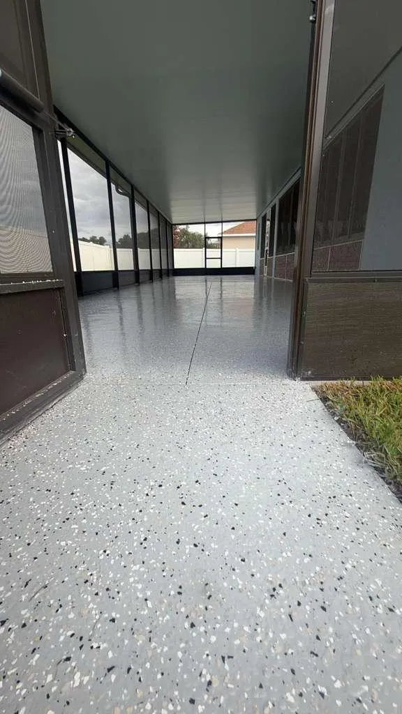 Gray flake epoxy lanai floor detail installed by Epoxy One