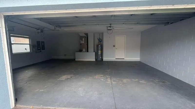 Garage floor with worn, failing coating before Epoxy One